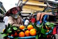 Hawker selling tangerine outside temple