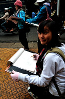 Students doing sketches at the market