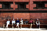 Local people sitting outside the Royal Palace