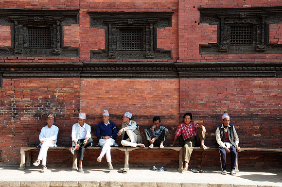 Local people sitting outside the Royal Palace