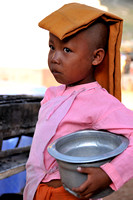 Little young nun going around for alms